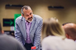Photo of smiling Josh Clark in a workshop group