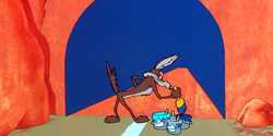 Wile E. Coyote painting a tunnel onto a cliff face